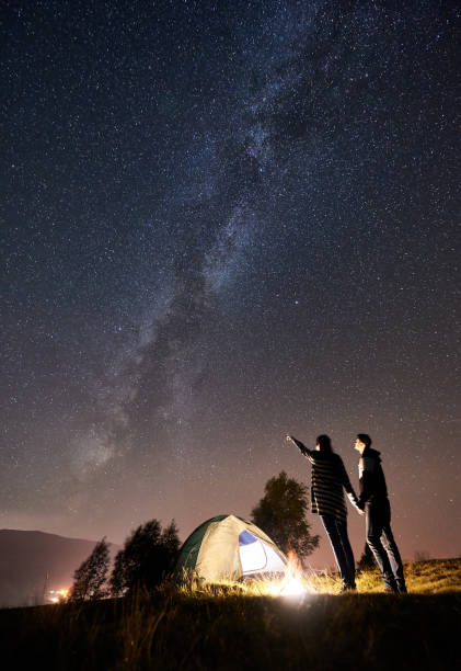 istock Couple tourists resting at night camping under stars 1133634194