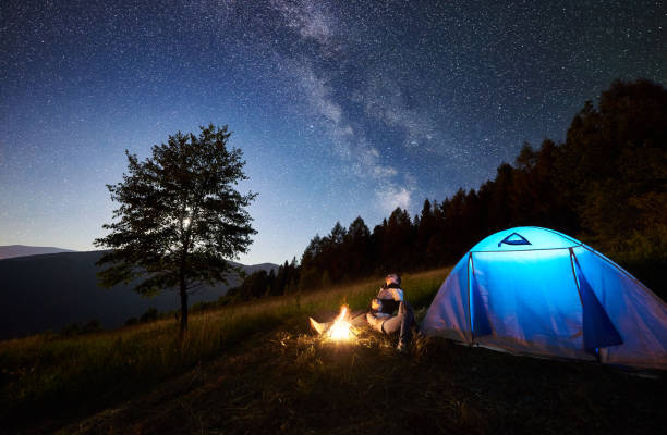 istock Couple tourists resting at night camping under stars 1133634206