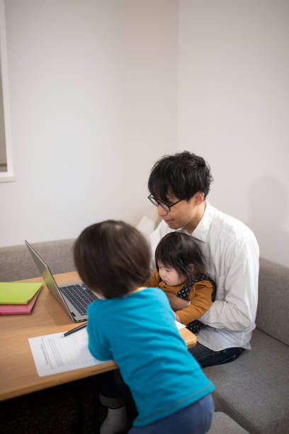 istock Father working from home with baby and child 1133634880