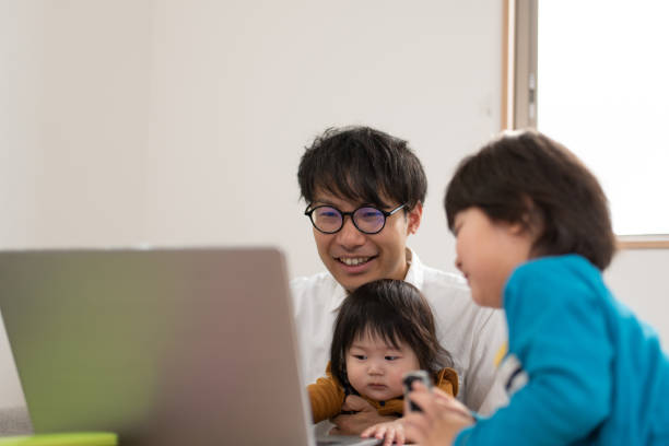 istock Father working from home with baby and child 1133634963