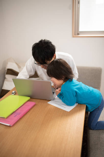 istock Father working at home with child 1133635096