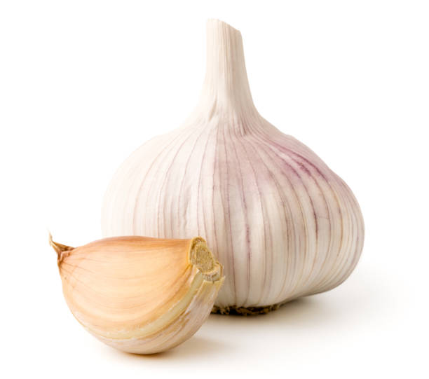 istock Head of garlic and slice on a white, close up. 1133635291