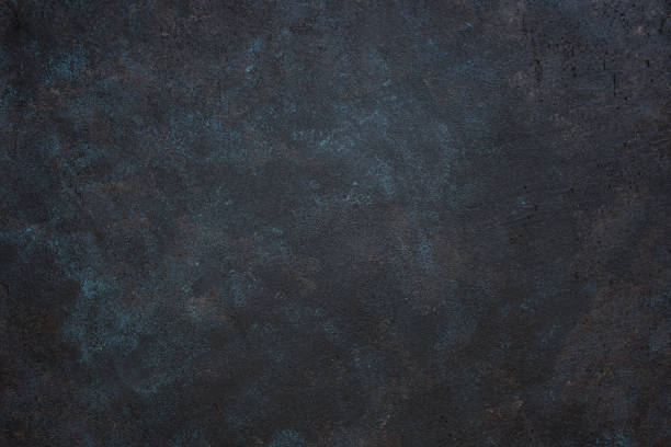 istock Textured dark rough background with blue and yellow spots 1133636028