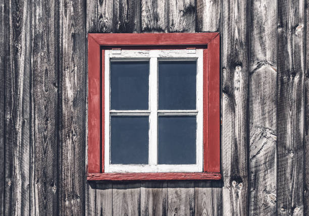Window of a traditional rustic house. Wooden cabin in Quebec, Canada.