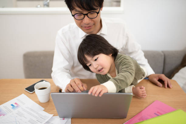 istock Father working at home with child 1133636477