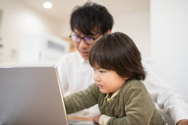 istock Father working at home with child 1133636503