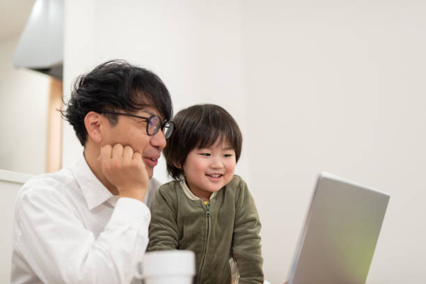 istock Father working at home with child 1133636650