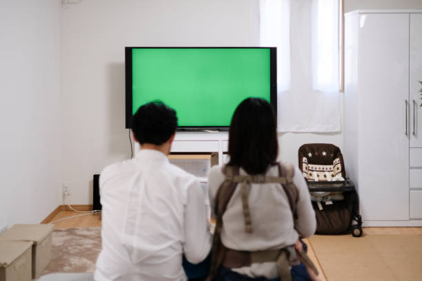 istock Married couple watching TV in room 1133636877