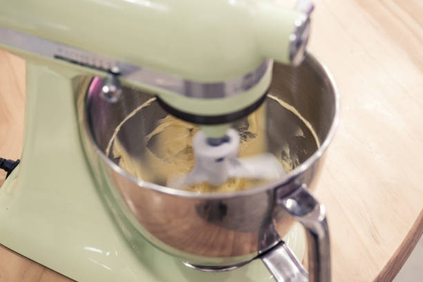 istock Mixing buttercream frosting with a stand-up kitchen mixer. 1133637030