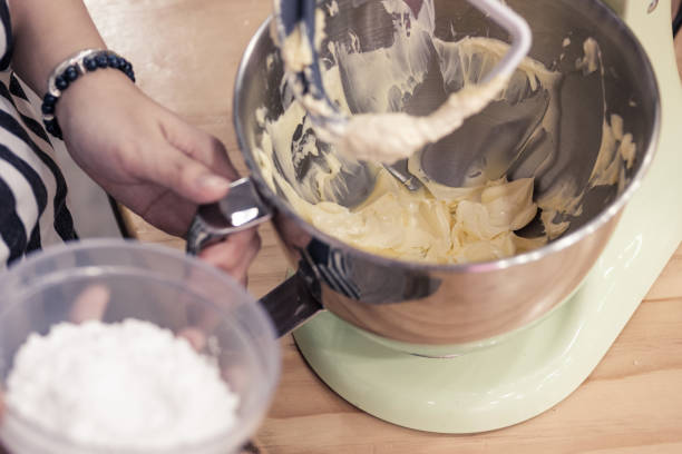istock Mixing buttercream frosting with a stand-up kitchen mixer. 1133637056