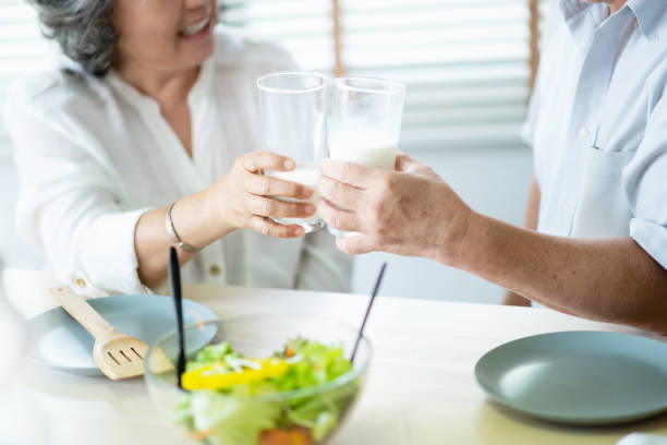 istock Asian couple having drinking milk. 1133637112