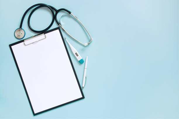 istock Blue medical background with clipboard and stethoscope 1133637774