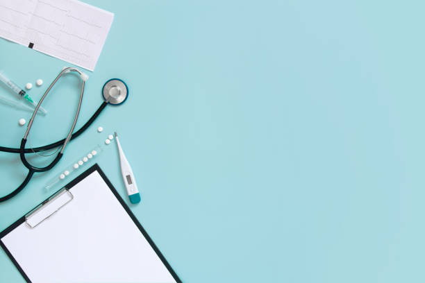 istock Blue medical background with clipboard and stethoscope 1133637775