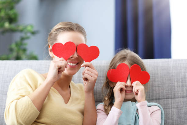 istock Beautiful mom and her daughter having fun at home 1133639904
