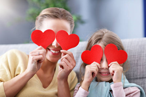 istock Beautiful mom and her daughter having fun at home 1133639922