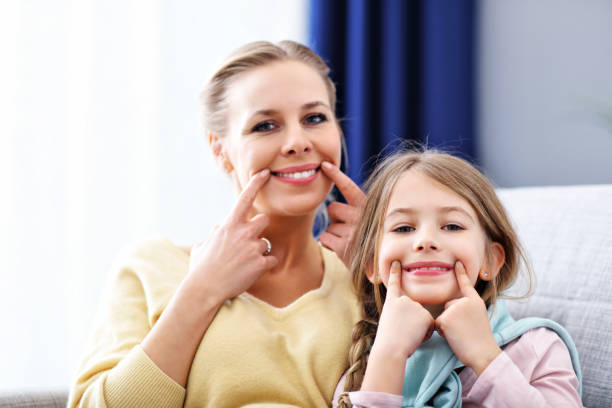 istock Beautiful mom and her daughter having fun at home 1133639932