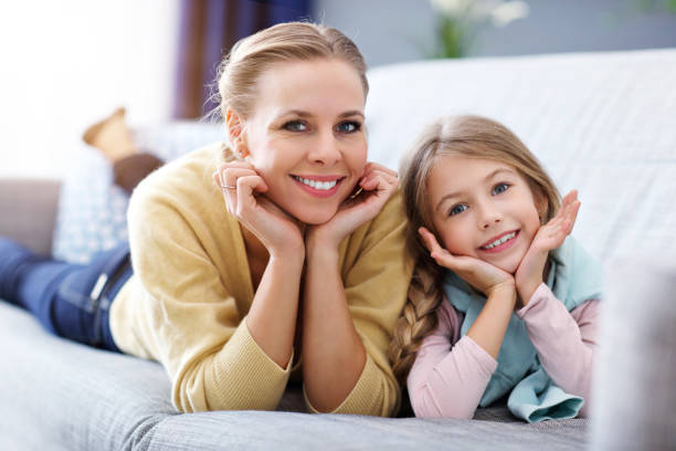 istock Beautiful mom and her daughter having fun at home 1133639949