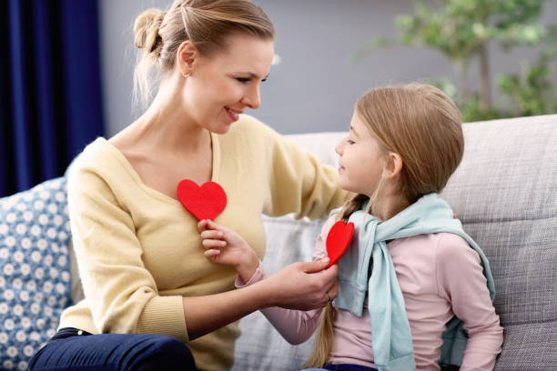 istock Beautiful mom and her daughter having fun at home 1133640039
