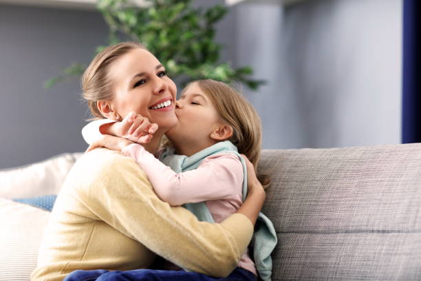 istock Beautiful mom and her daughter having fun at home 1133640070
