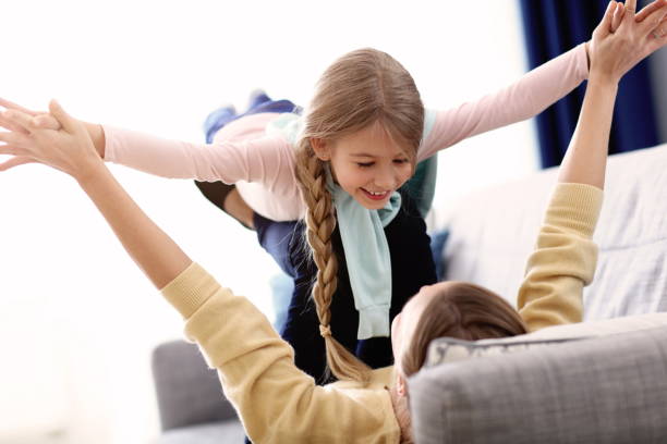 istock Beautiful mom and her daughter having fun at home 1133640137