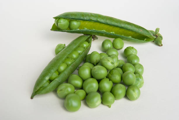 istock Many fresh green peas and two pods 1133643196