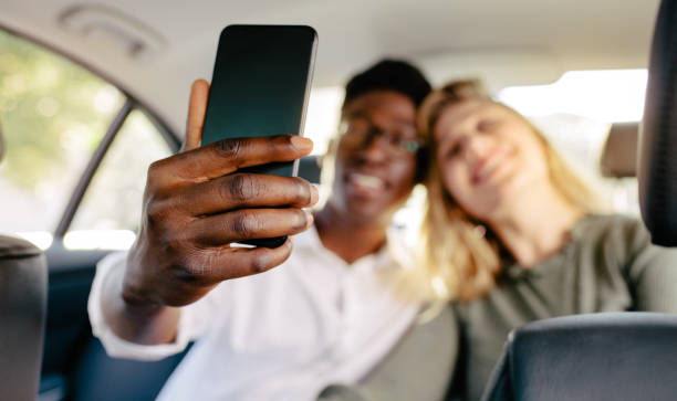 istock Couple in car taking selfie 1133644297