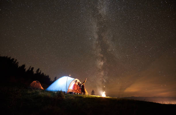 istock Night summer camping in the mountains under night starry sky 1133646653