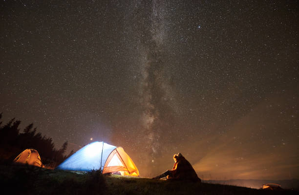 istock Night summer camping in the mountains under night starry sky 1133646661