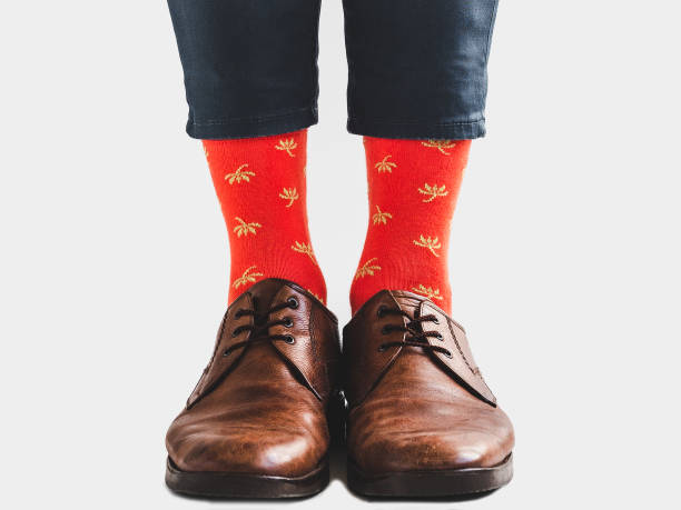 istock Men's legs, trendy shoes and bright socks 1133646740