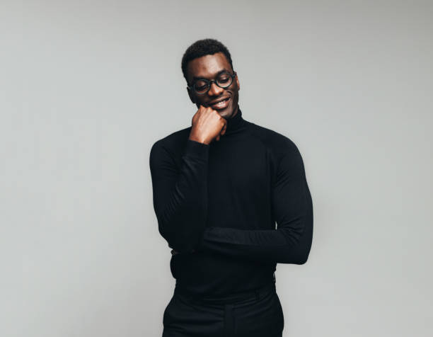 istock Smiling african man lost in thoughts 1133647177