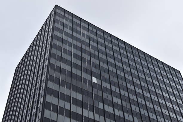 istock Black and Grey Building with one White Window 1133649571