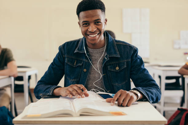 istock Smiling male student in university classroom 1133649700