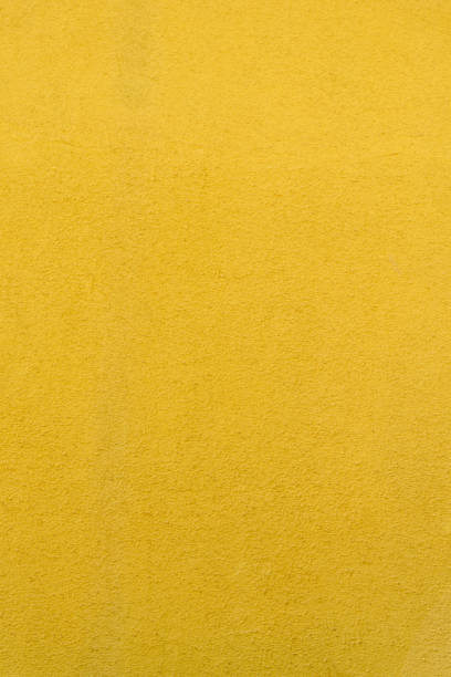 trama di una parete gialla con imperfezioni - lautaro foto e immagini stock