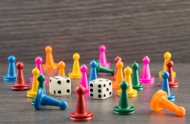 istock Colorful wooden game pieces with dices 1133650237
