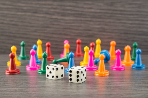 istock Colorful wooden game pieces with dices 1133651365