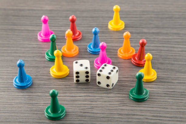 istock Colorful wooden game pieces with dices 1133651501