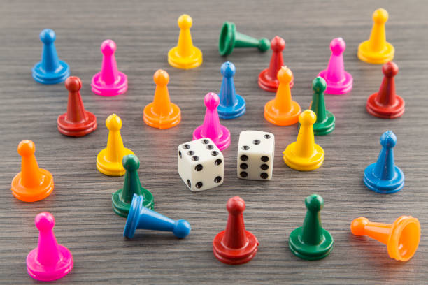 istock Colorful wooden game pieces with dices 1133651518
