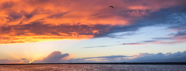istock Vibrant sunset over the Pacific Ocean from Marina del Rey, CA jetty. 1133653511