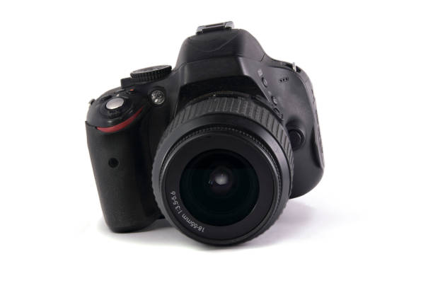 istock modern digital SLR photo camera with lens on white background. isolated. 1133655158