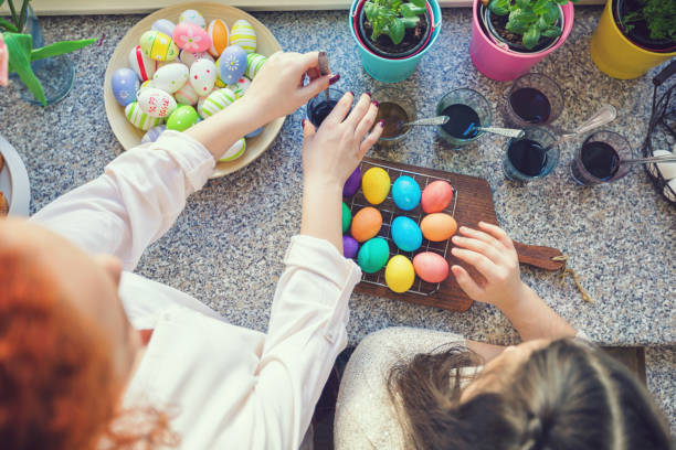 istock Young Family Painting Easter Eggs 1133655818