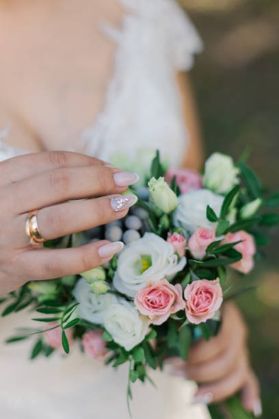 istock Very beautiful bride is holding a bouquet 1133656992
