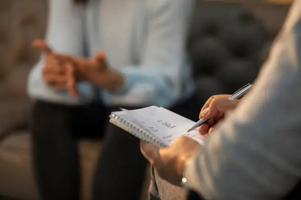 Professional psychologist doctor listening and giving the consult to female patients - Mental health concept