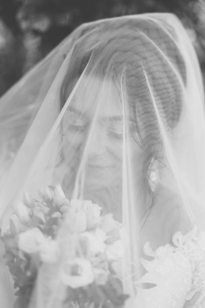 istock Very beautiful bride is holding a bouquet 1133657944