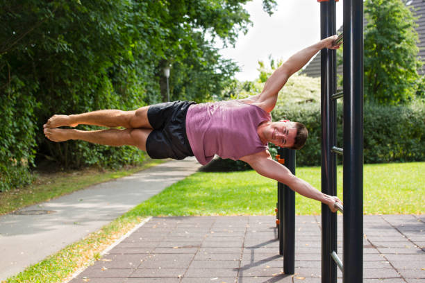 istock Young athlete having calisthenics flag workout. 1133660847