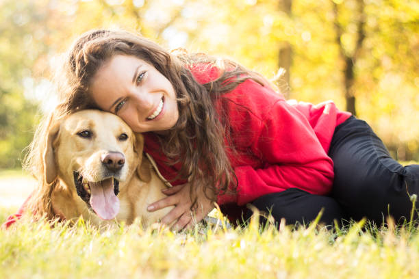 istock Young smiling woman with her cute dog 1133661834