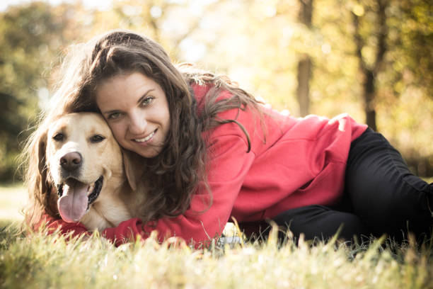 istock Young smiling woman with her cute dog 1133661894