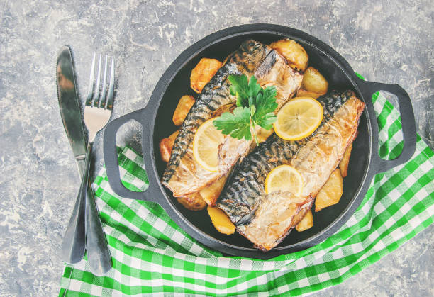 istock baked fish mackerel and potatoes. Selective focus. 1133663055