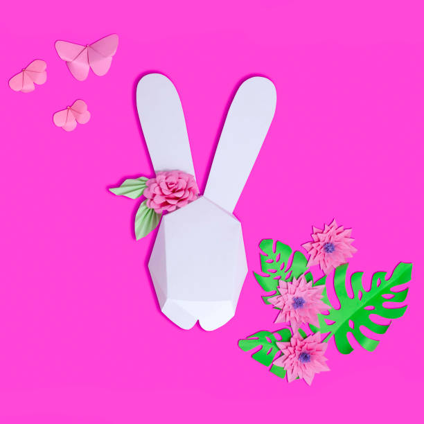 istock Easter paper decor. 3D Easter bunny, flowers and butterflies 1133664210