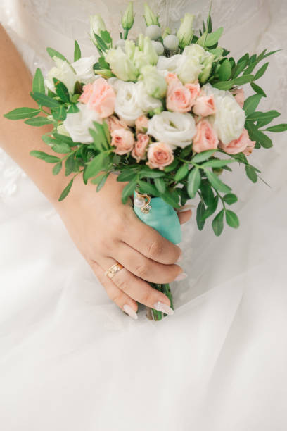 istock Very beautiful bride is holding a bouquet 1133669437