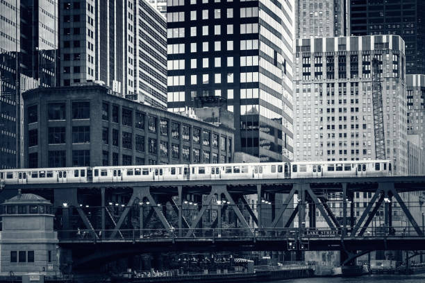 istock Black and white view of elevated railway train in Chicago, 1133669697